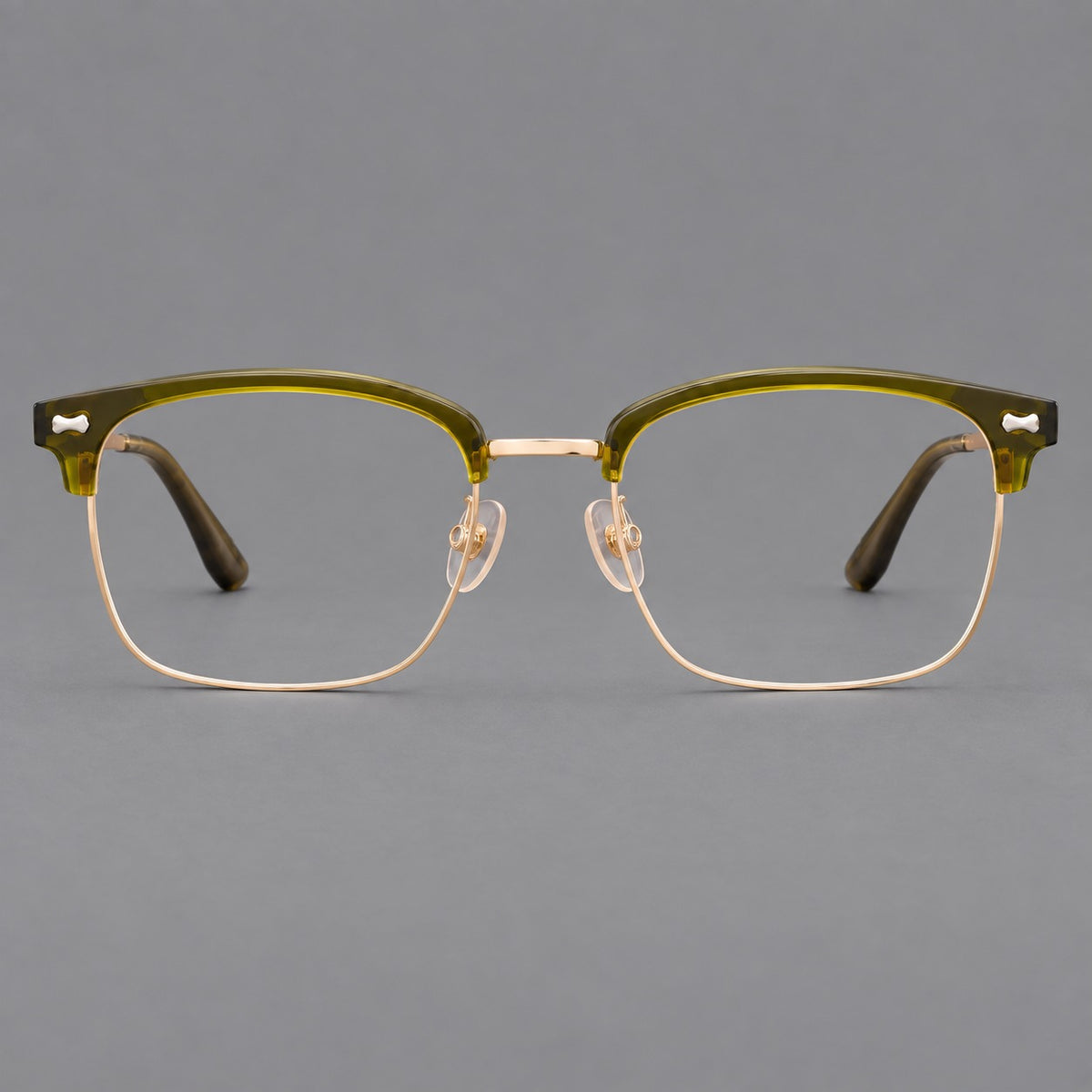 Classic browline titanium glasses with fine lower rims and subtle corner accents in Green and Gold, front view