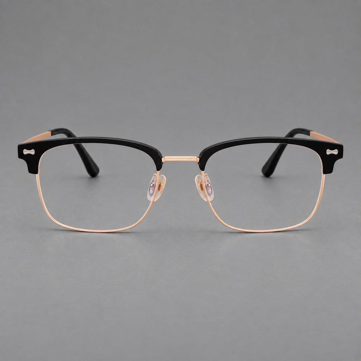 Classic browline titanium glasses with fine lower rims and subtle corner accents in Black and Rose Gold, front view