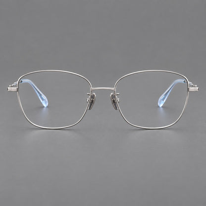 Soft square titanium glasses with angled upper corners and decorated hinges in Silver, front view temple detail