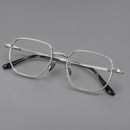 Retro square titanium glasses with rounded rims and finely grooved shoulders in Silver, three quarter view lens detail