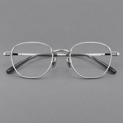 Retro panto titanium glasses with a curved bridge and fine parallel rim grooves in Black and Silver, front view frame detail