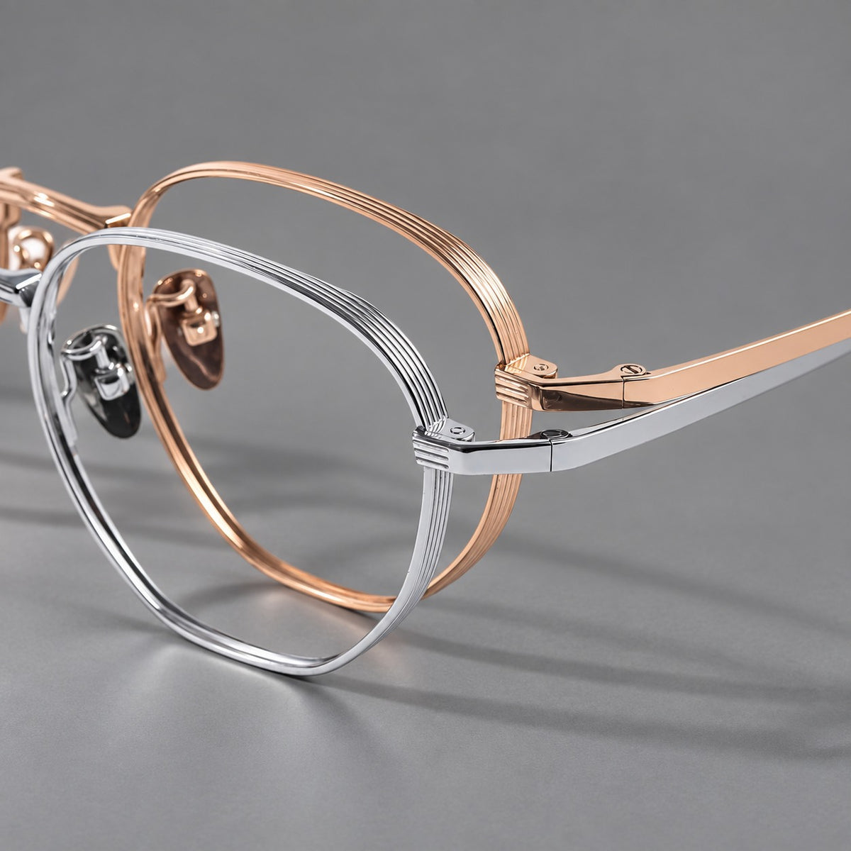 Retro panto titanium glasses with a curved bridge and fine parallel rim grooves, frame details