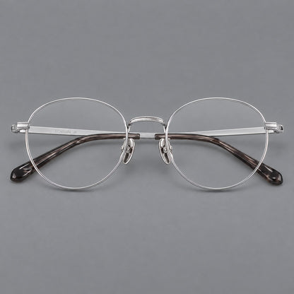 Rounded panto titanium glasses with a raised bridge and dotted temple accents in Silver, front view additional product view