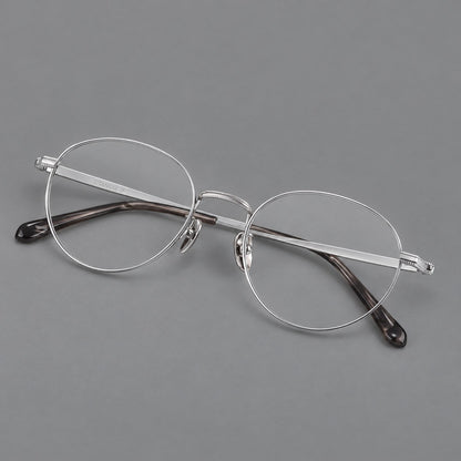 Rounded panto titanium glasses with a raised bridge and dotted temple accents in Silver, three quarter view additional product view