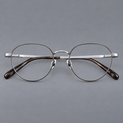 Classic round titanium glasses with broad flat temples and inset hinge details in Grey and Silver, front view frame detail