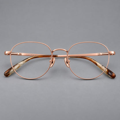 Classic round titanium glasses with broad flat temples and inset hinge details in Rose Gold, front view additional product view