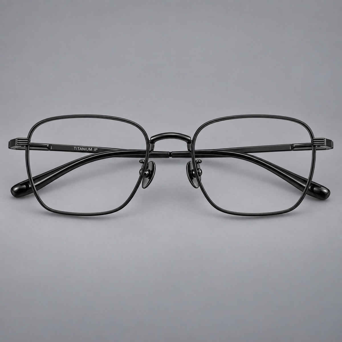 Deep square titanium glasses with a flatter brow and grooved outer shoulders in Black, front view