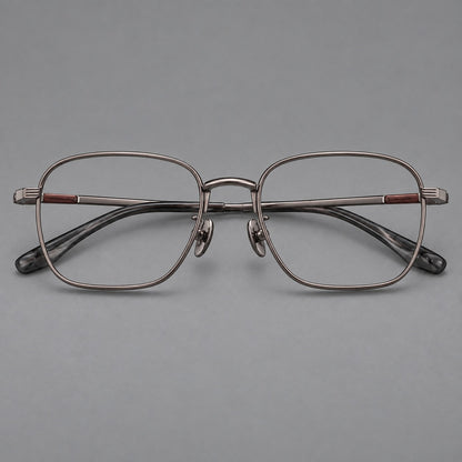 Deep square titanium glasses with a flatter brow and grooved outer shoulders in Gunmetal, front view frame detail