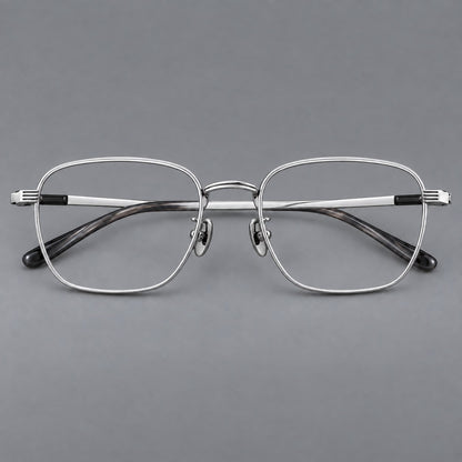 Deep square titanium glasses with a flatter brow and grooved outer shoulders in Black and Silver, front view temple detail