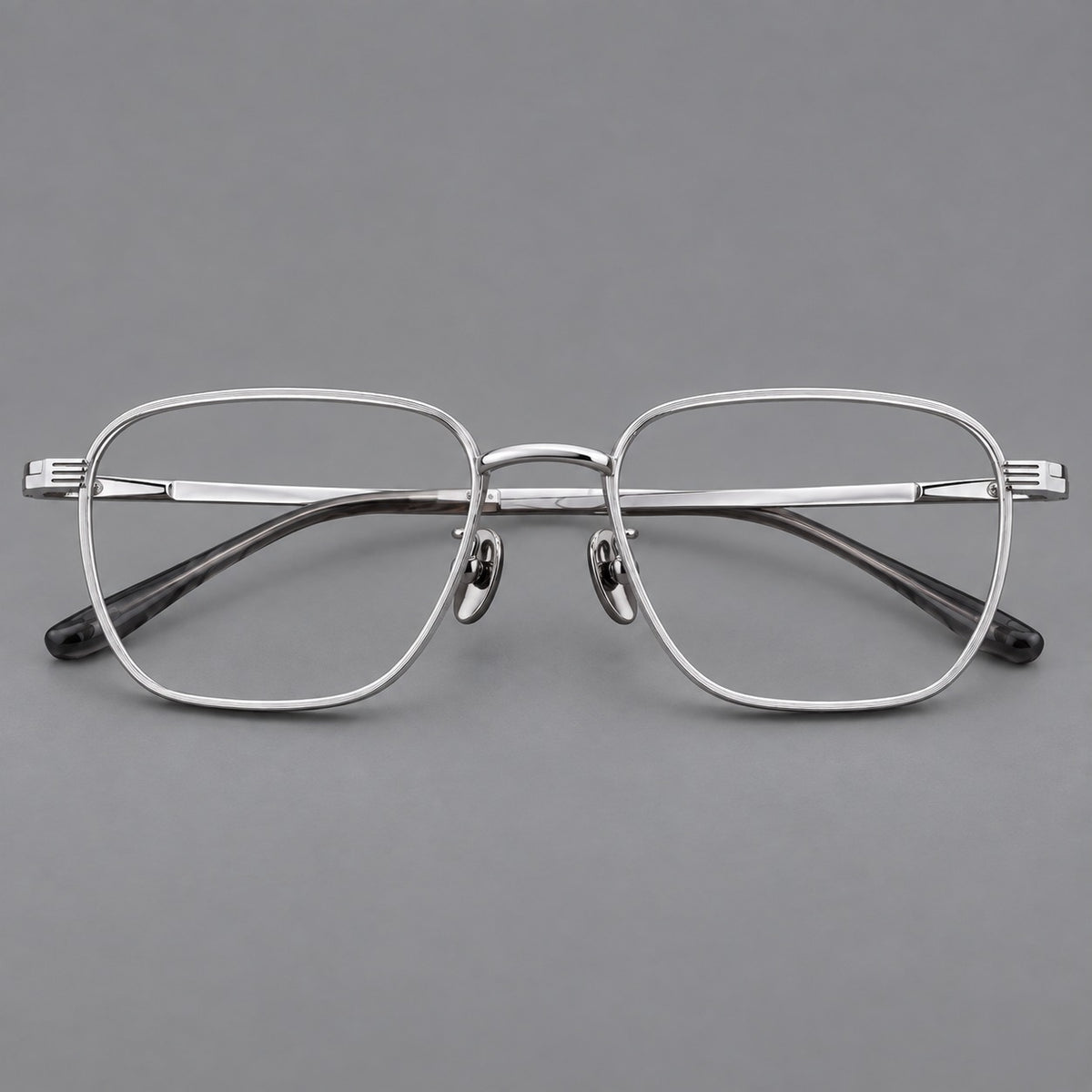Deep square titanium glasses with a flatter brow and grooved outer shoulders in Silver, front view