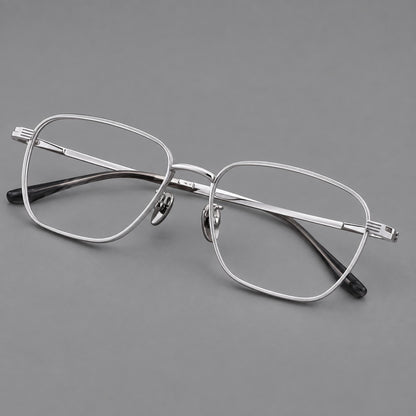Deep square titanium glasses with a flatter brow and grooved outer shoulders in Silver, three quarter view additional product view