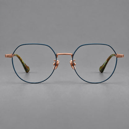 Geometric titanium glasses with soft polygonal rims and fine shoulder detailing in Blue and Rose Gold, front view temple detail