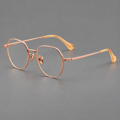 Geometric titanium glasses with soft polygonal rims and fine shoulder detailing in Rose Gold, three quarter view additional product view