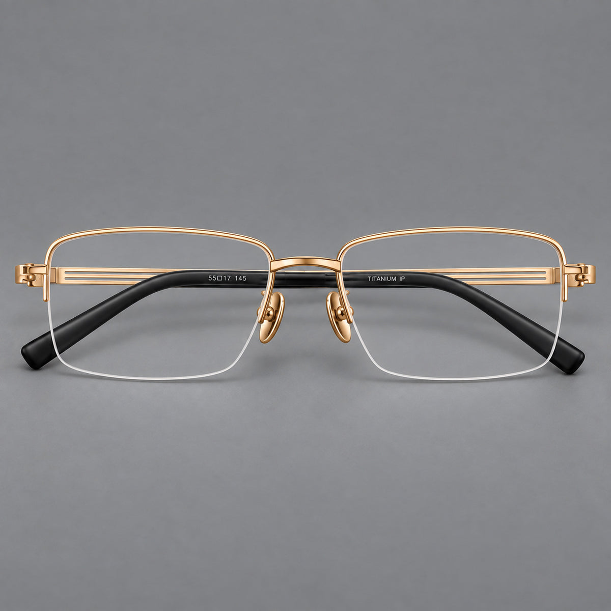 Classic half frame titanium glasses with rectangular lenses and lined temples in Gold, front view