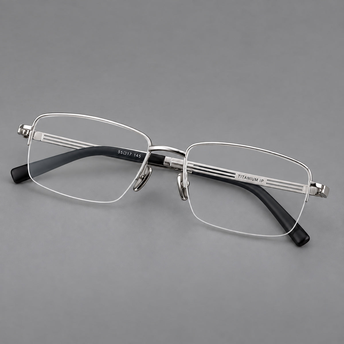 Classic half frame titanium glasses with rectangular lenses and lined temples in Silver, three quarter view