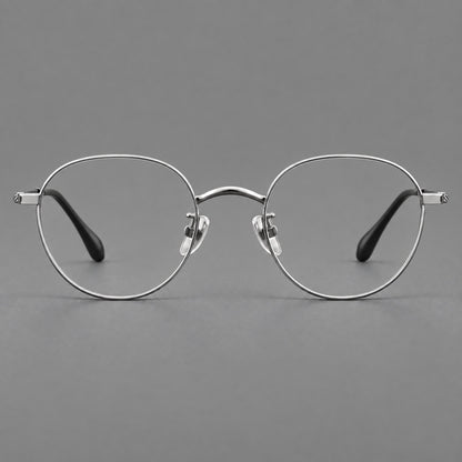 Compact round titanium glasses with an arched bridge and textured temple accents in Silver, front view additional product view