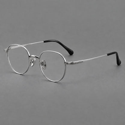Compact round titanium glasses with an arched bridge and textured temple accents in Silver, three quarter view additional product view