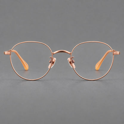 Compact round titanium glasses with an arched bridge and textured temple accents in Rose Gold, front view additional product view