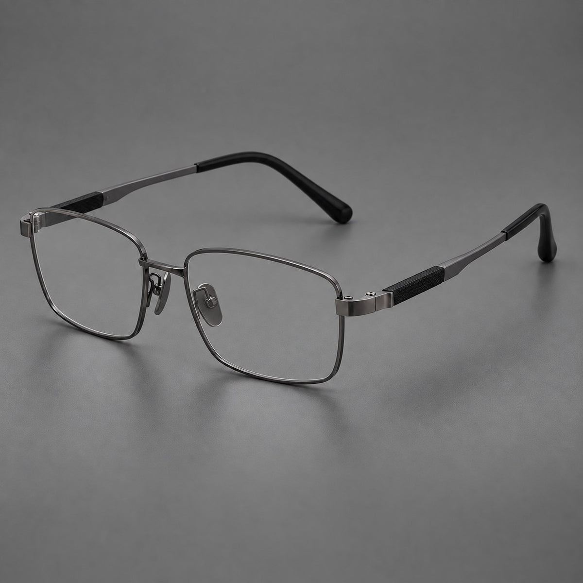 Slim rectangular titanium glasses with broad temples and contrasting dark inserts in Gunmetal, three quarter view