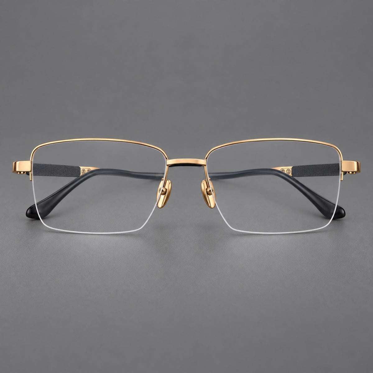 Wide half frame titanium glasses with rectangular lenses and textured temples in Gold, front view