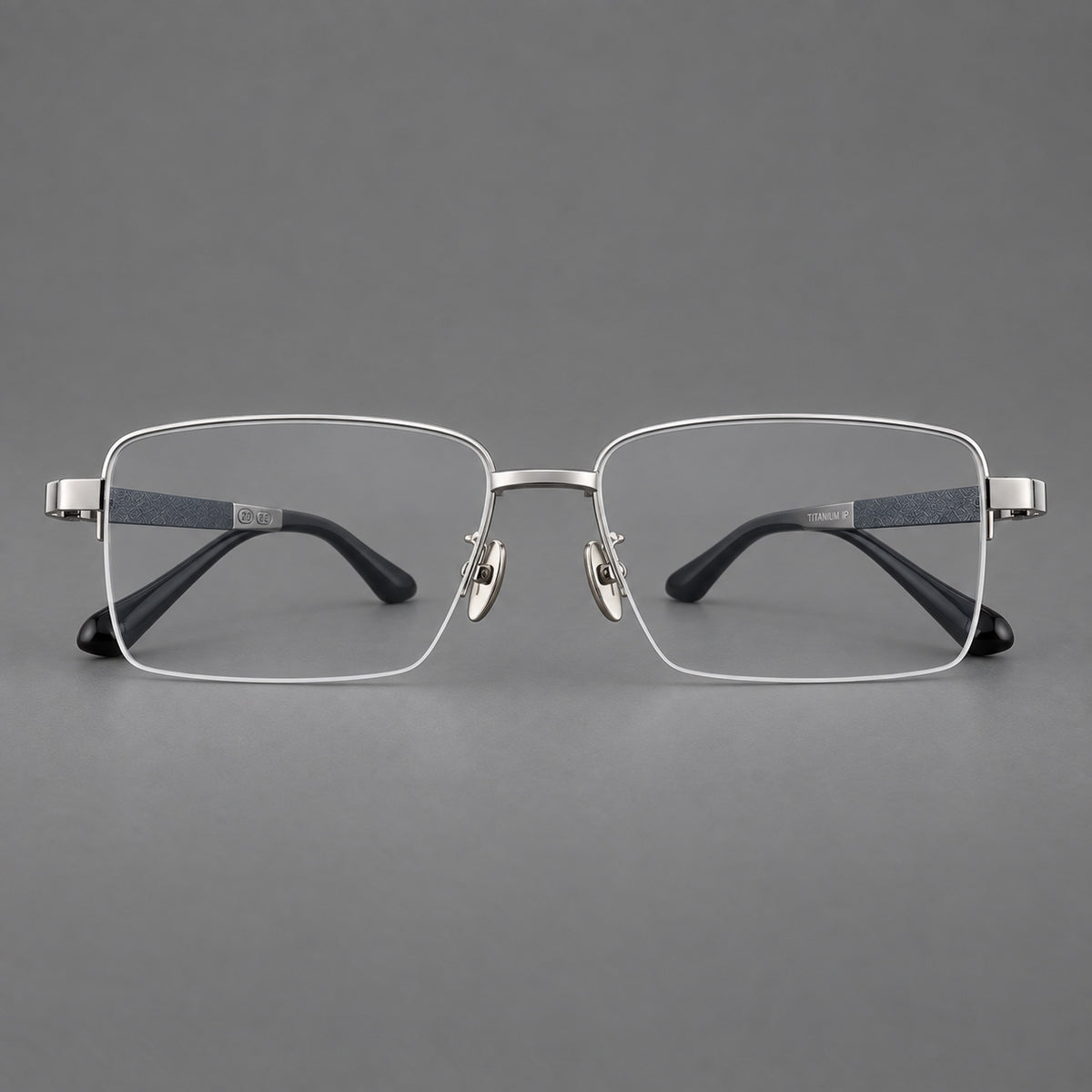 Wide half frame titanium glasses with rectangular lenses and textured temples in Silver, front view