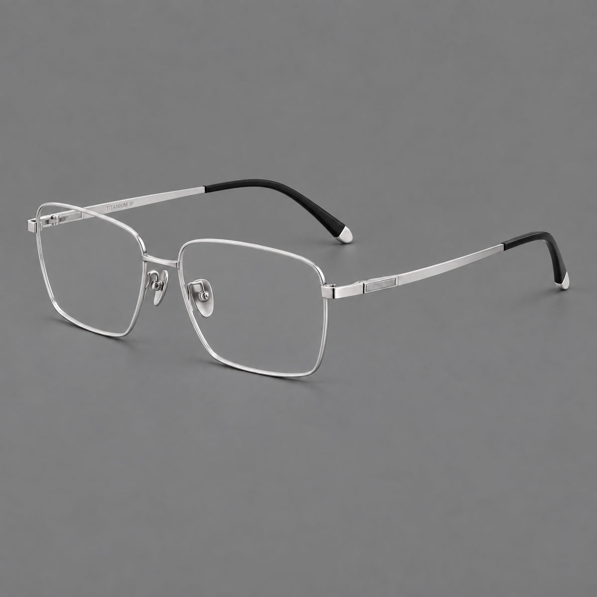 Clean rectangular titanium glasses with inset temple details and pale end accents in Silver, three quarter view