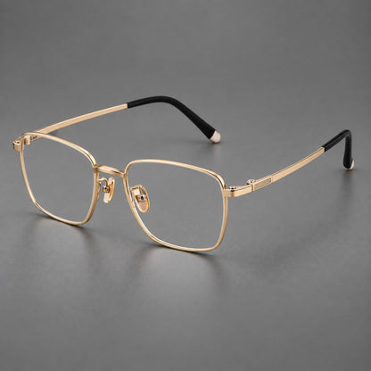 Clean rectangular titanium glasses with inset temple details and pale end accents in Gold, three quarter view additional product view