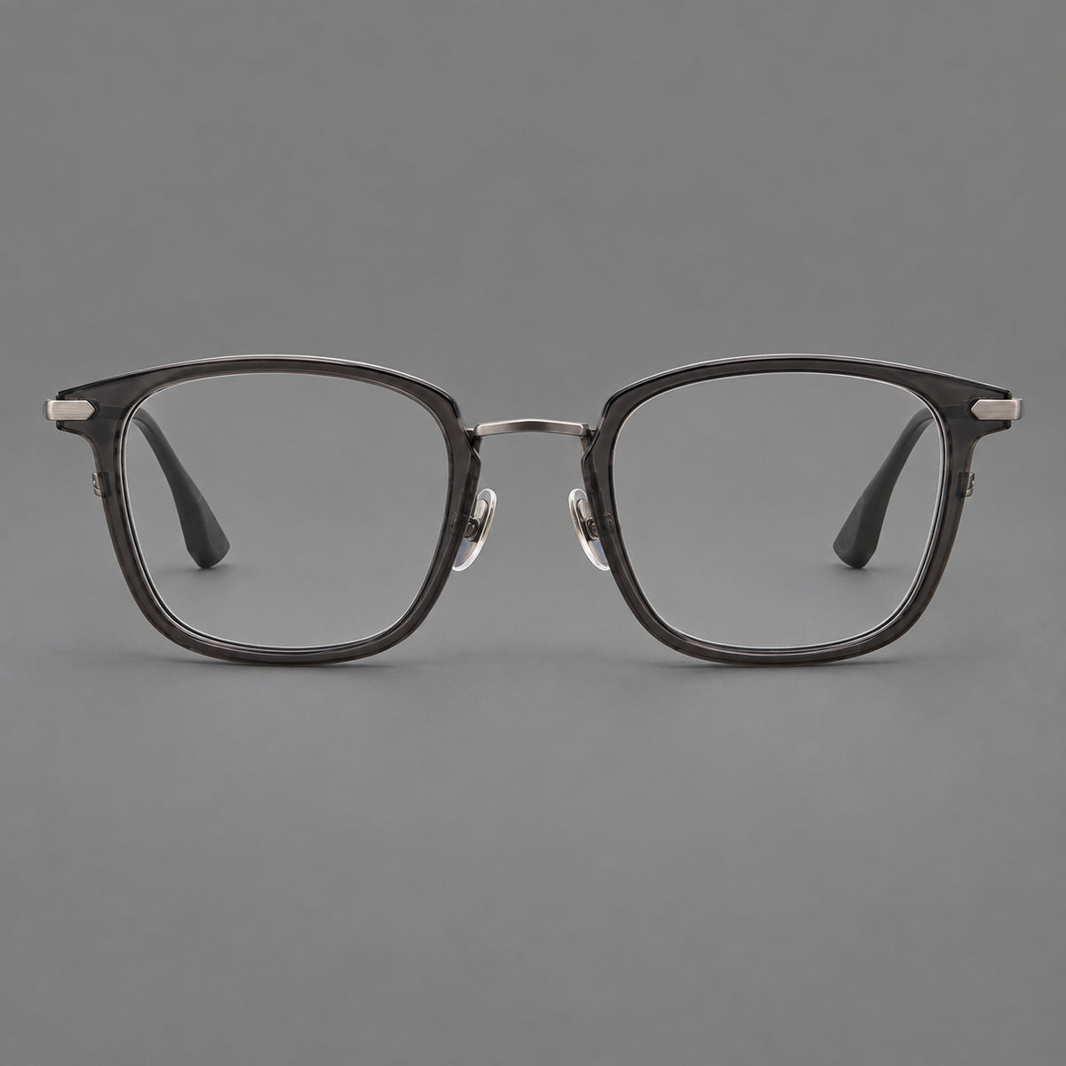 Bold square titanium glasses with a separate bridge and long metal corner accents in Gunmetal, front view