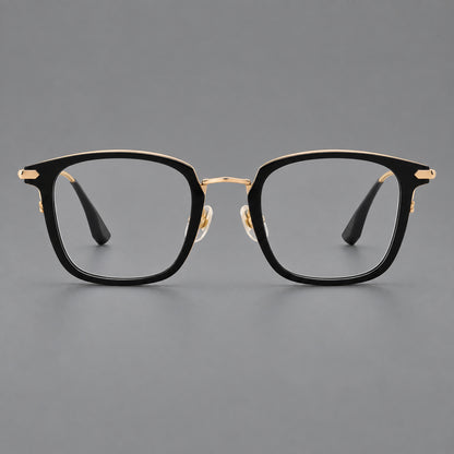 Bold square titanium glasses with a separate bridge and long metal corner accents in Black and Gold, front view frame detail
