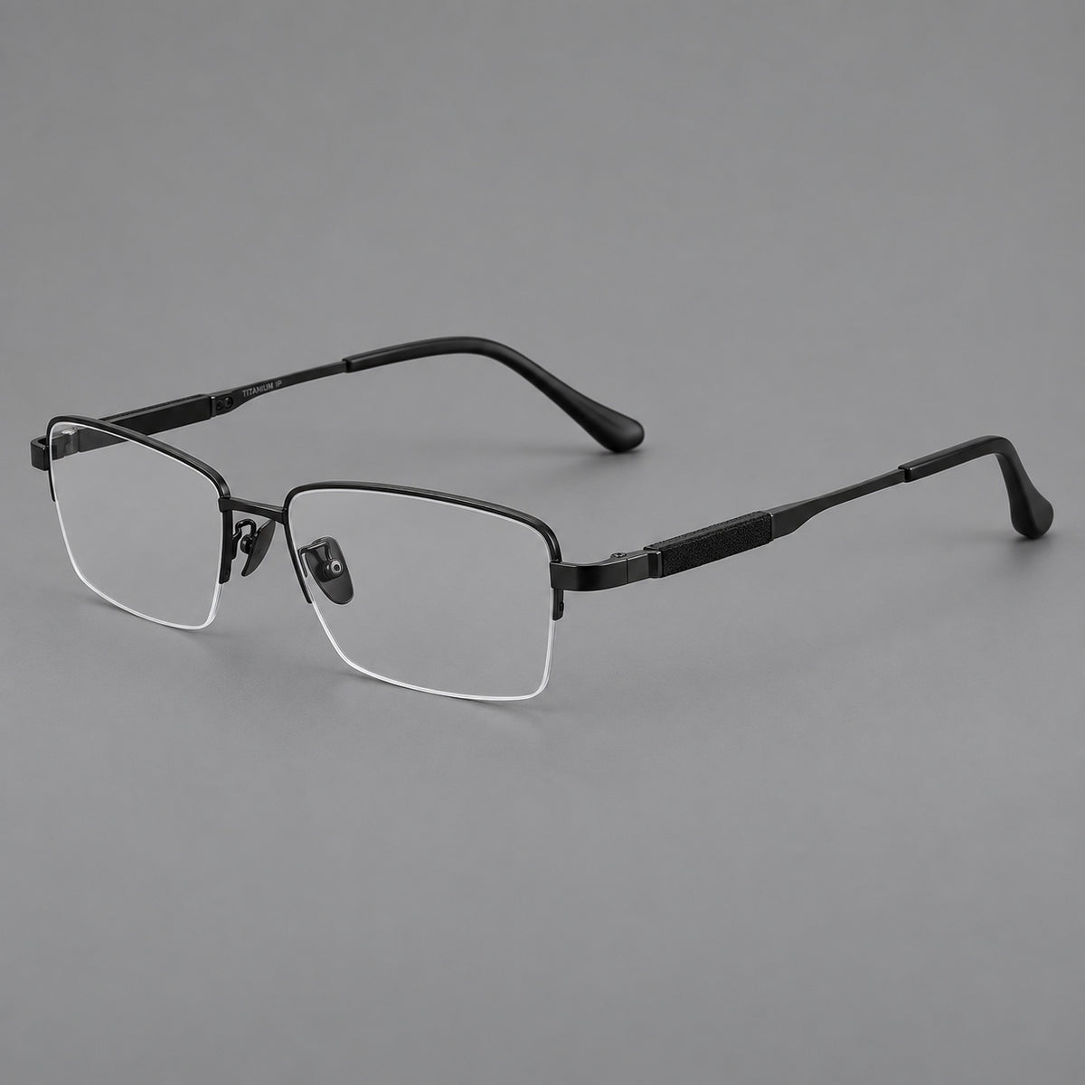 Modern half frame titanium glasses with a narrow bridge and dark temple sections in Black, three quarter view