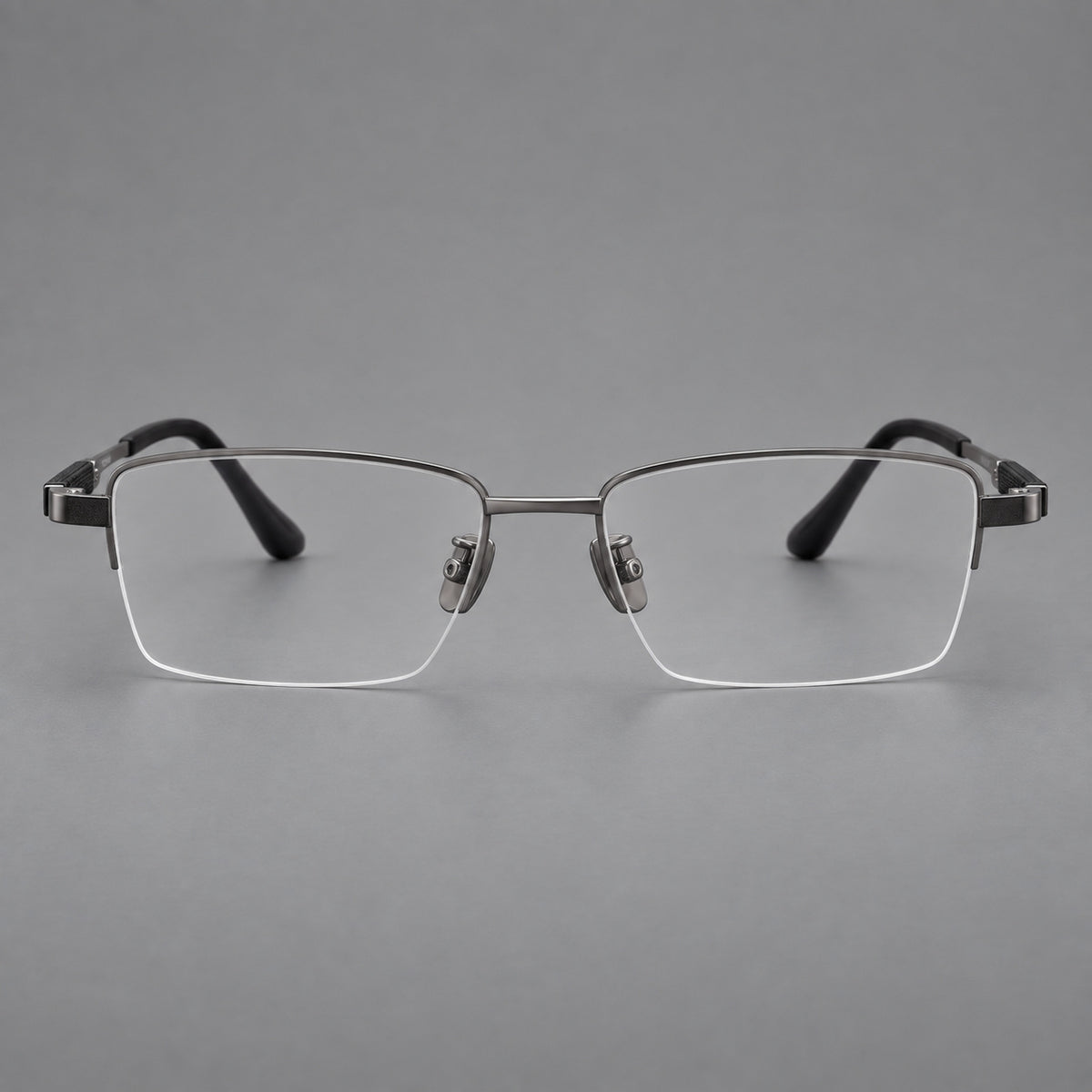Modern half frame titanium glasses with a narrow bridge and dark temple sections in Grey, front view