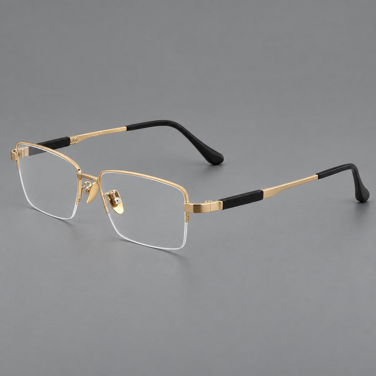 Modern half frame titanium glasses with a narrow bridge and dark temple sections in Gold, three quarter view