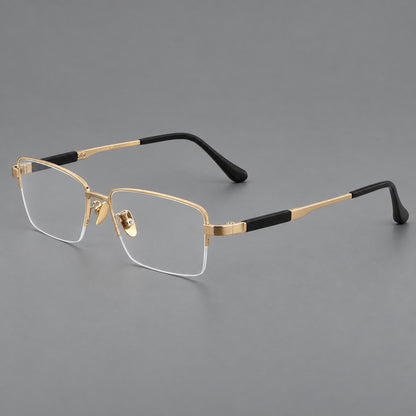 Modern half frame titanium glasses with a narrow bridge and dark temple sections in Gold, three quarter view lens detail