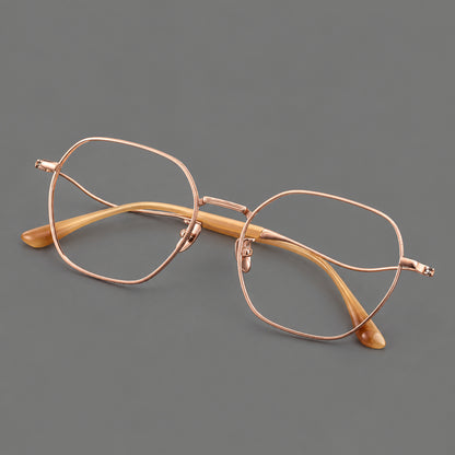 Geometric titanium glasses with engraved rim edges and curved temple joins in Rose Gold, three quarter view additional product view