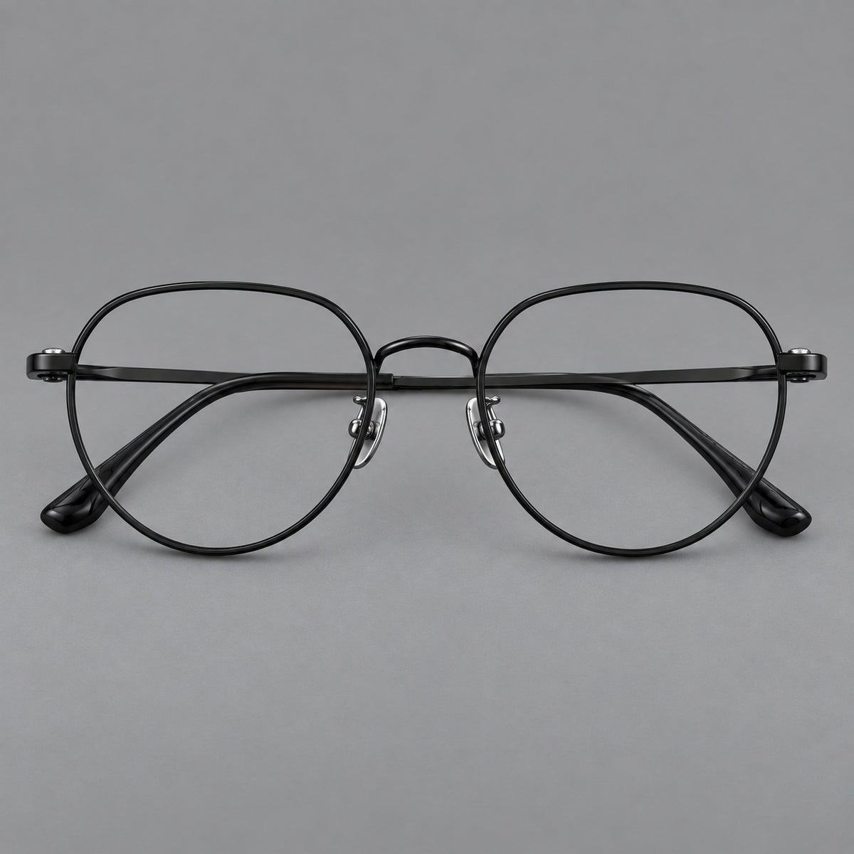 Classic panto titanium glasses with a curved bridge and slim straight temples in Black, front view