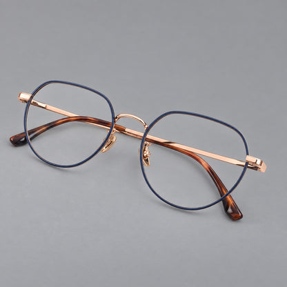 Classic panto titanium glasses with a curved bridge and slim straight temples in Blue and Rose Gold, three quarter view lens detail
