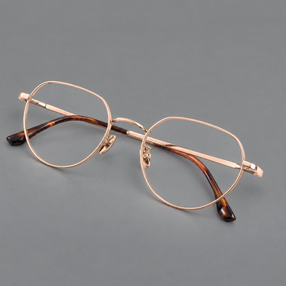 Classic panto titanium glasses with a curved bridge and slim straight temples in Rose Gold, three quarter view additional product view