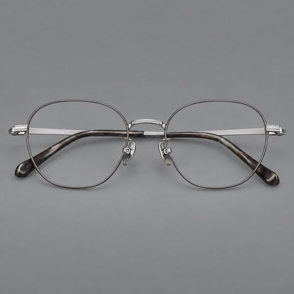 Retro panto titanium glasses with stepped corners and finely engraved temples in Grey and Silver, front view temple detail