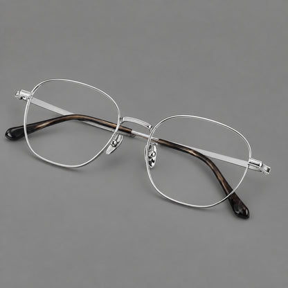 Retro panto titanium glasses with stepped corners and finely engraved temples in Silver, three quarter view additional product view