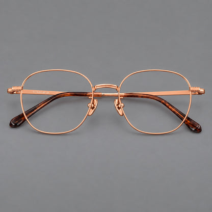 Retro panto titanium glasses with stepped corners and finely engraved temples in Rose Gold, front view additional product view