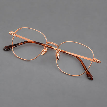 Retro panto titanium glasses with stepped corners and finely engraved temples in Rose Gold, three quarter view additional product view