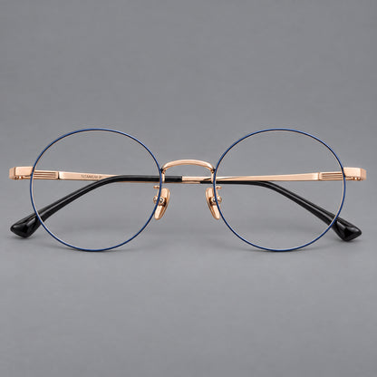 Classic circular titanium glasses with a raised bridge and lined temple accents in Blue and Gold, front view frame detail