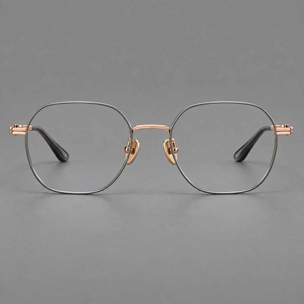 Soft square titanium glasses with an angular bridge and layered corner details in Green and Rose Gold, front view