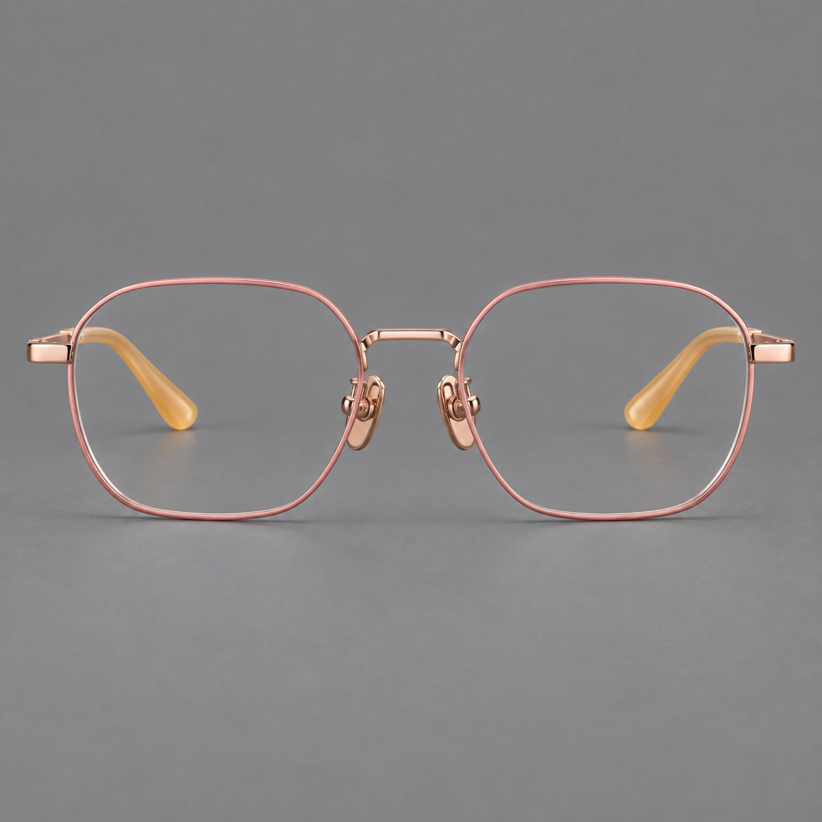 Rounded panto titanium glasses with an angular bridge and broad flat temples in Pink and Rose Gold, front view
