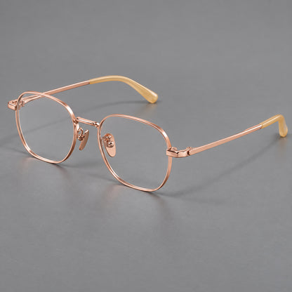 Rounded panto titanium glasses with an angular bridge and broad flat temples in Rose Gold, three quarter view additional product view