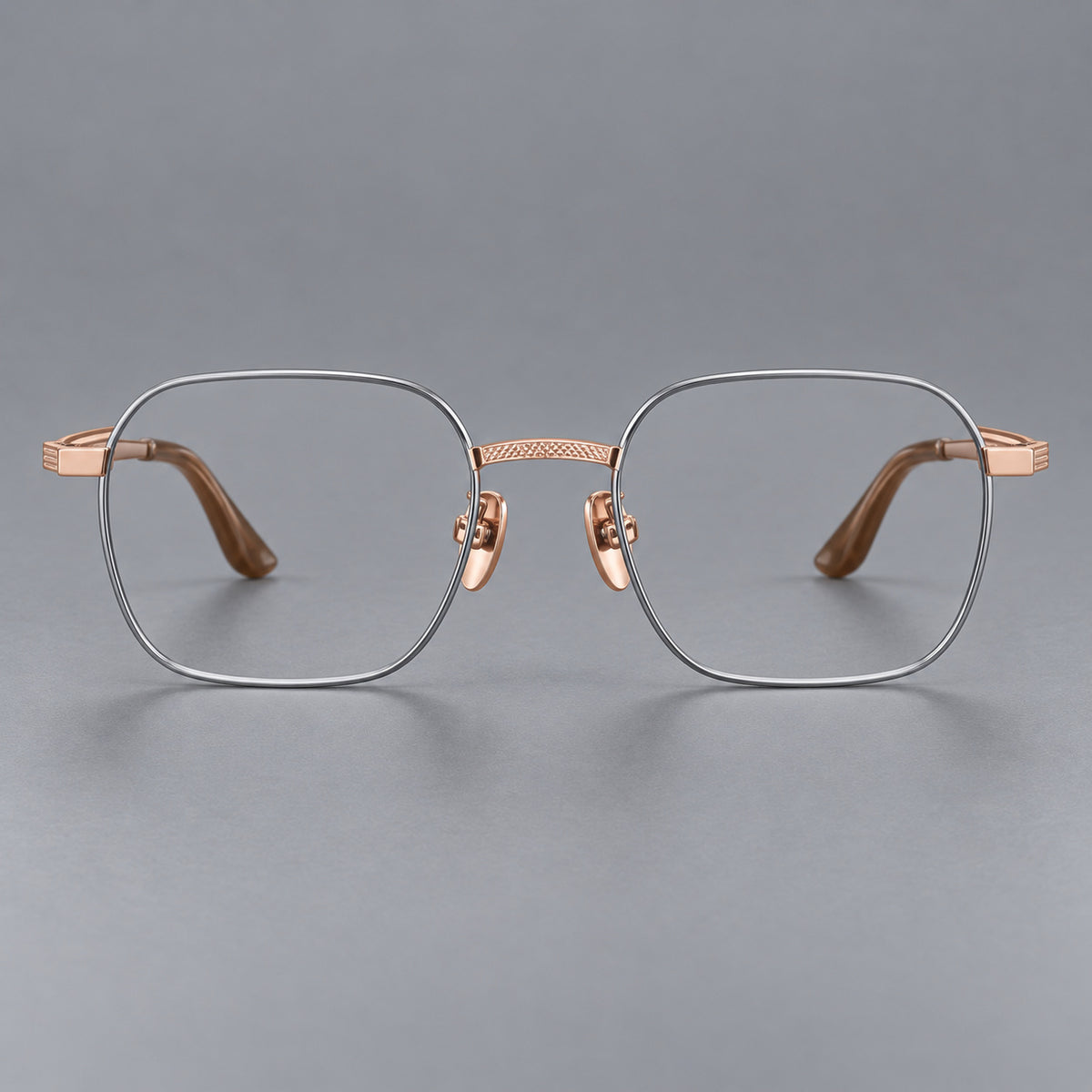 Geometric square titanium glasses with a textured bridge and fine temple grooves in Grey and Rose Gold, front view