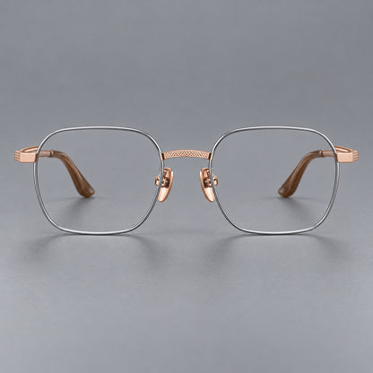Geometric square titanium glasses with a textured bridge and fine temple grooves in Grey and Rose Gold, front view frame detail