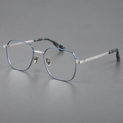 Geometric square titanium glasses with a textured bridge and fine temple grooves in Blue and Silver, three quarter view lens detail