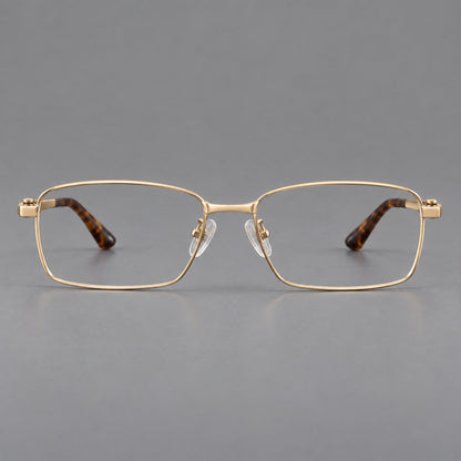 Wide rectangular titanium glasses with a broad bridge and rounded hinge caps in Gold, front view temple detail