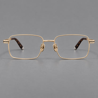 Rectangular titanium glasses with inset corner lines and metal capped temple tips in Gold, front view temple detail